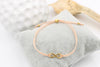 Infinity Armband in pfirsich mit Kugelverschluss in gold