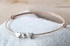 rosenholz farbenes Armband aus Leder mit 2 Herzen und 1 Stern in silber sowie einem Schiebeknoten Verschluss
