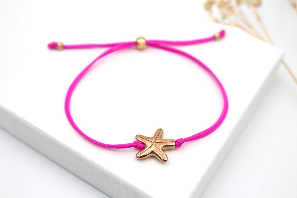 pinkes Makramee Armband Seestern Anhänger in rosegoldfarben
