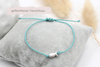 aquamarin farbenes Iyhthys Armband aus Makramee und Fisch silber 