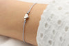 silberfarbenes Makramee Armband mit Herz und Perlen
