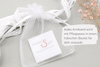 weißer Organzabeutel als Verpackung für dein Infinity Armband