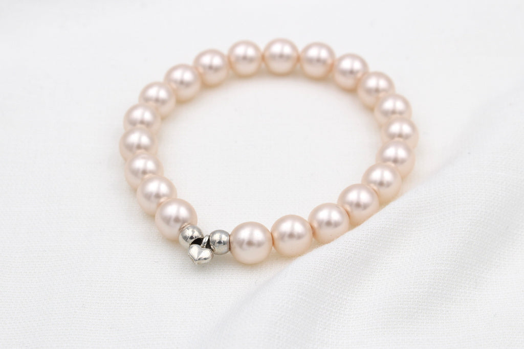 rosa perlmutt farbenes Perlenarmband mit Herz Anhänger in silber für Frauen