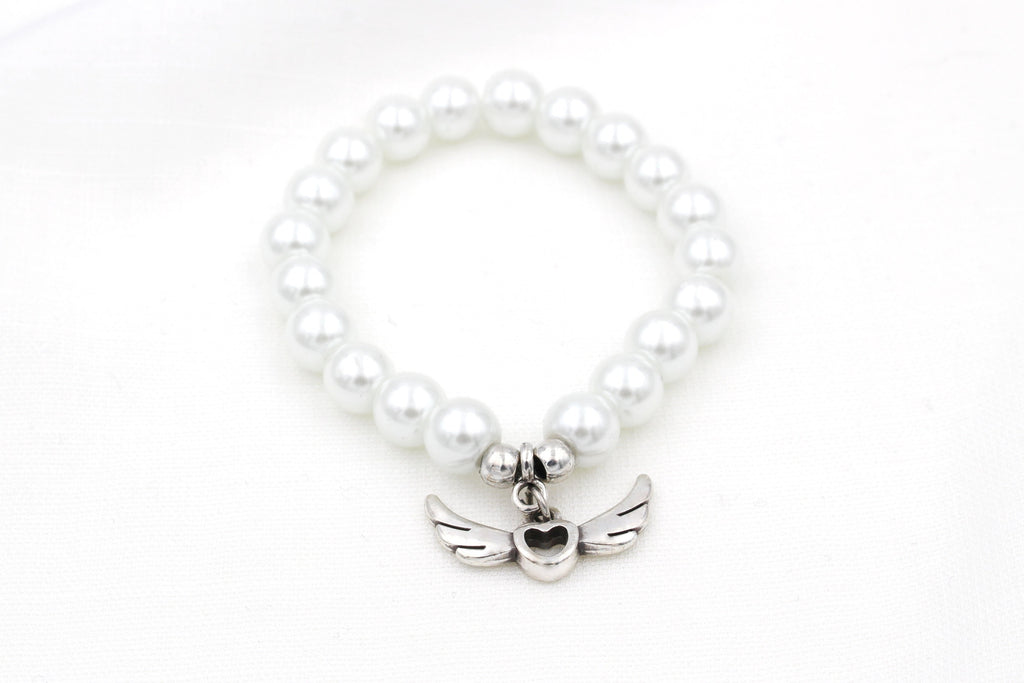 Armband Kommunion mit Engelsflügel als Anhänger in silber in weiß perlmutt