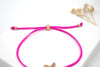 pink rosa farbenes Armband mit Seestern in der Mitte und einem modernen Kugelverschluss zum verstellen