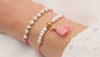 Video der 2 er Set Sommerarmband Damen in pink und koralle am Handgelenk getragen