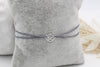 Armband Damen mit floralem Anhänger als kleine Blume