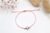 rosa Kreuz Armband als christliches Symbol zur Taufe